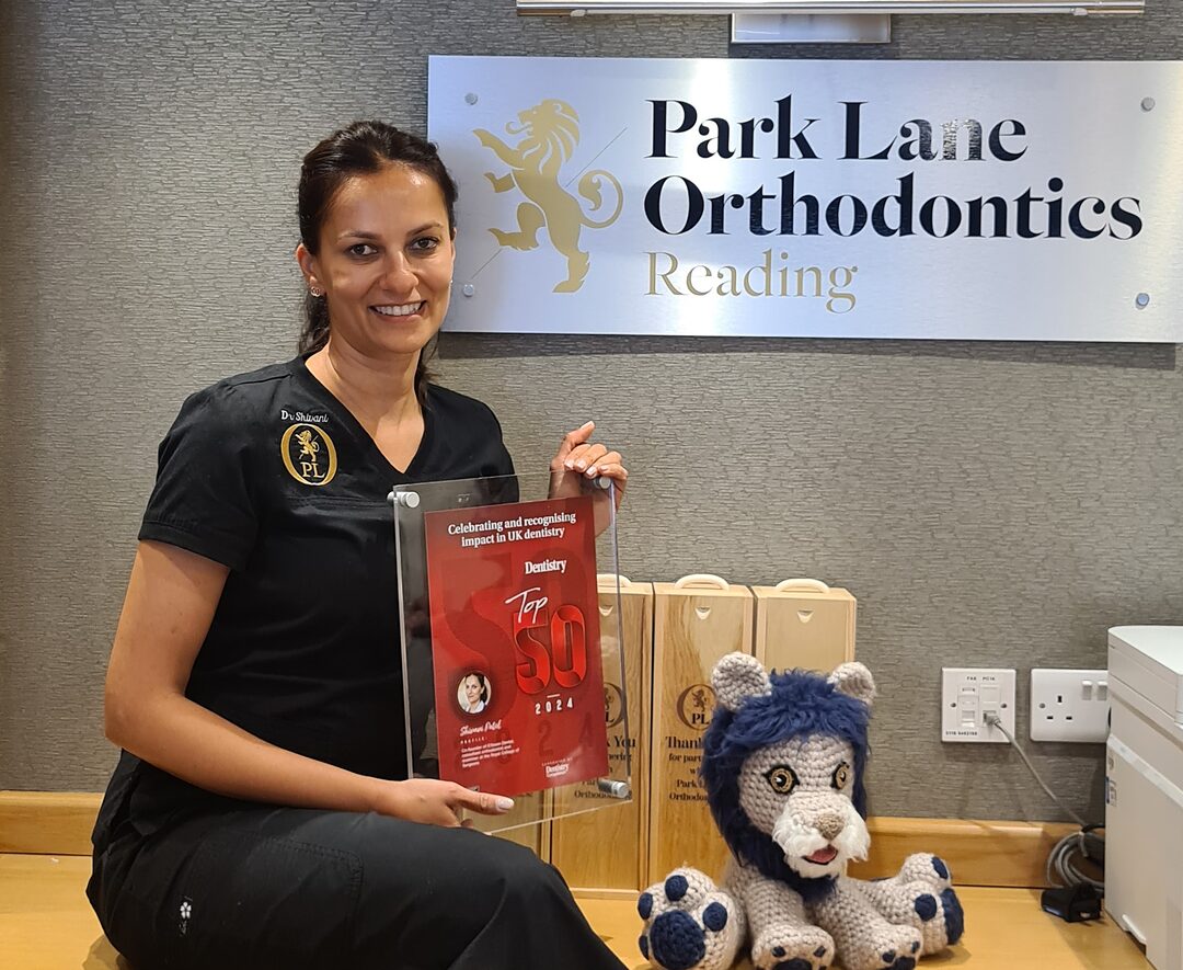 Consultant orthodontist Dr Shivani Patel with the practice's Dentistry Top 50 award at Park Lane Orthodontics in Reading